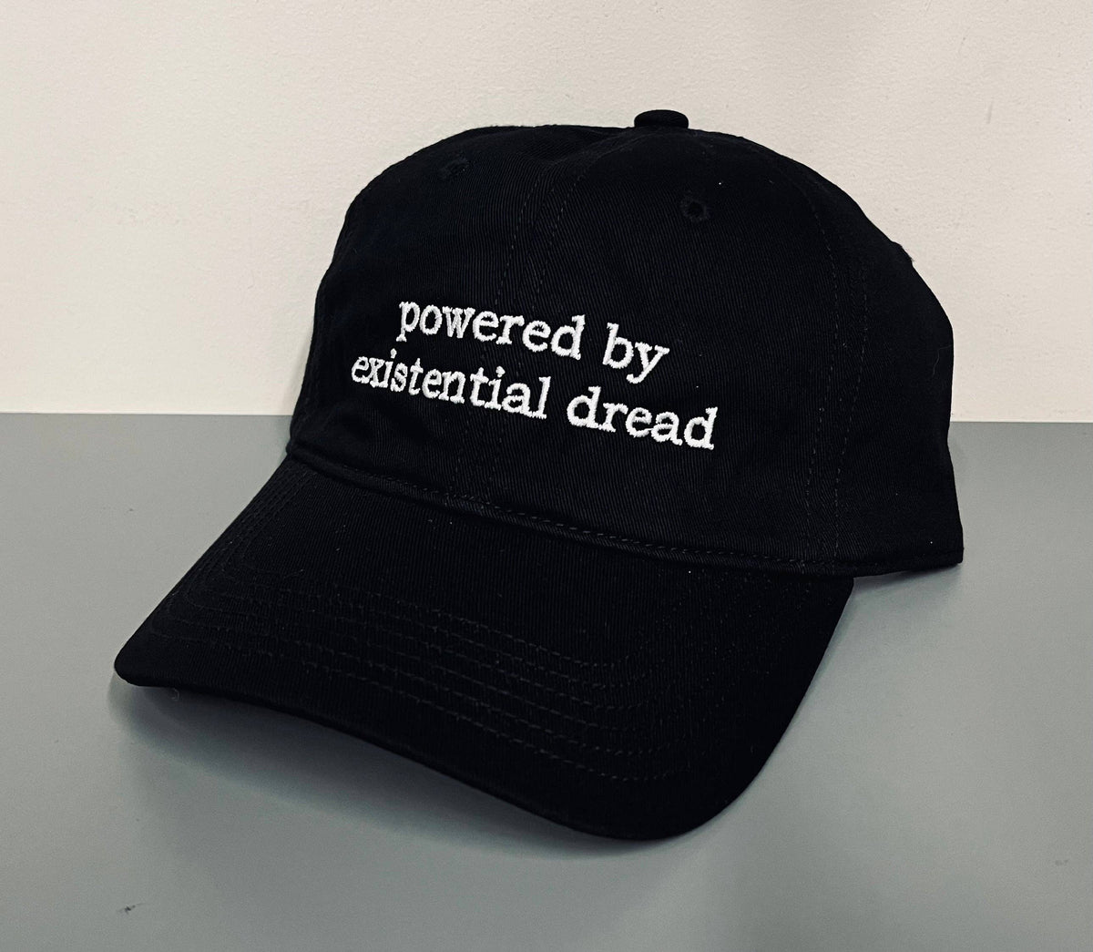 Powered by existential dread - embroidered dad hat - READY TO SHIP